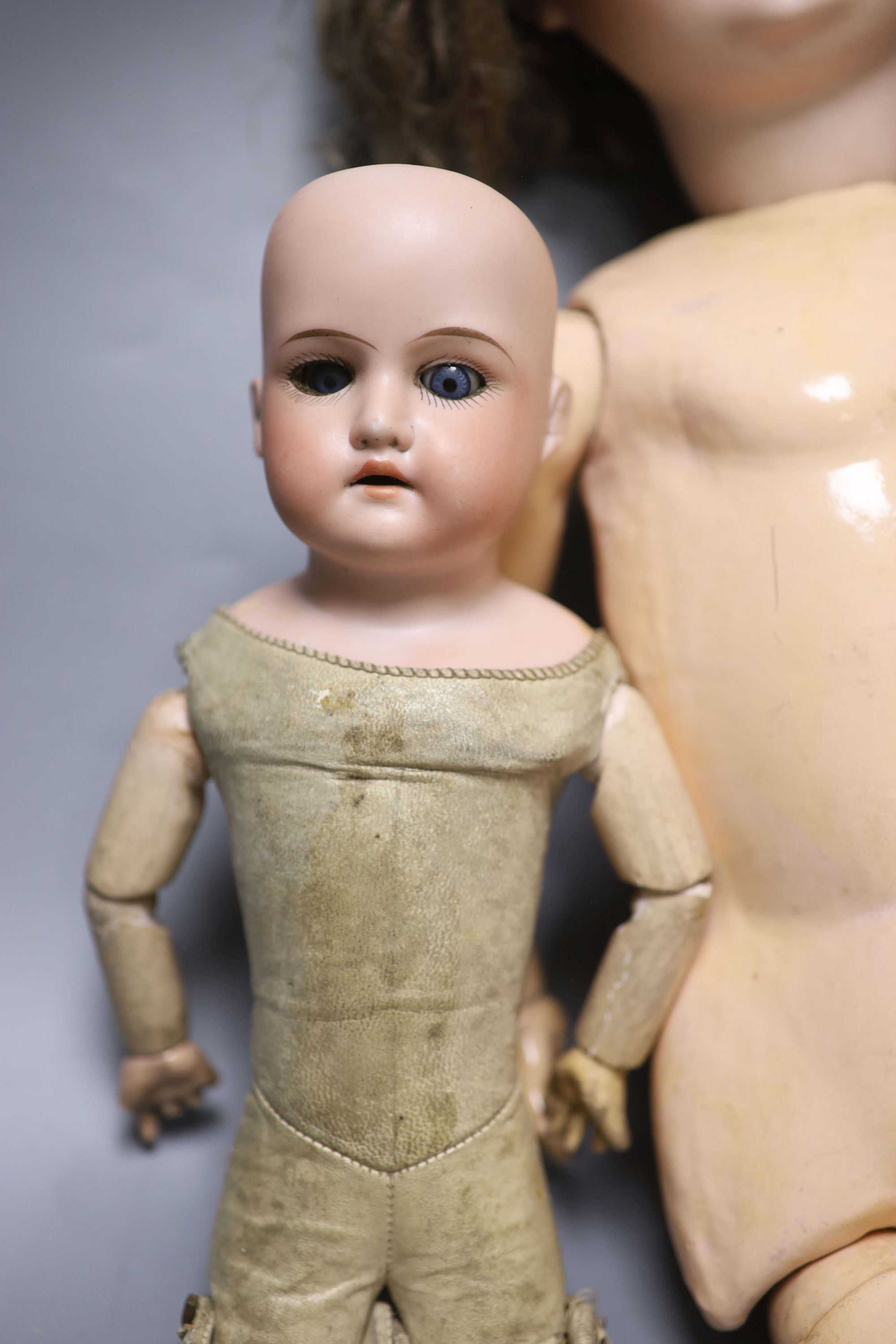 Two Armand Marseille bisque head dolls, 370 AM 4 DEP and 370 AM 2/0 DEP, with jointed kid bodies and a Koppelsdorf bisque head doll, ta